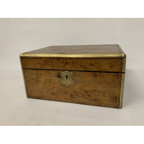 14 - A BURR WALNUT WRITING SLOPE WITH SECRET DRAWER AND BRASS BANDING