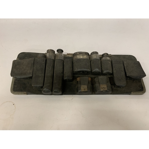 20 - A QUANTITY OF VANITY GLASS BOTTLES MOST WITH HALLMARKED SILVER LIDS, IN A HOLDER, PLUS  HALLMARKED S... 