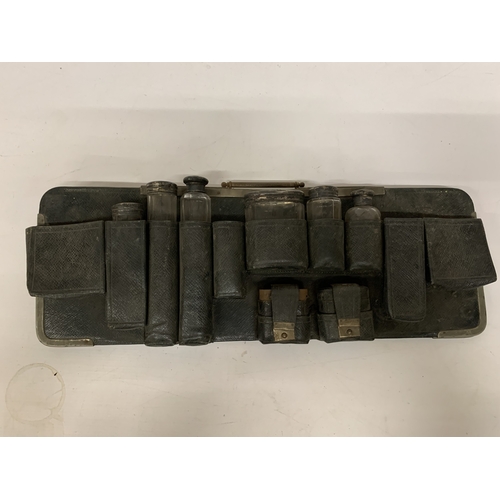 20 - A QUANTITY OF VANITY GLASS BOTTLES MOST WITH HALLMARKED SILVER LIDS, IN A HOLDER, PLUS  HALLMARKED S... 