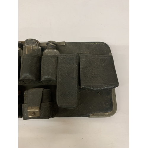 20 - A QUANTITY OF VANITY GLASS BOTTLES MOST WITH HALLMARKED SILVER LIDS, IN A HOLDER, PLUS  HALLMARKED S... 