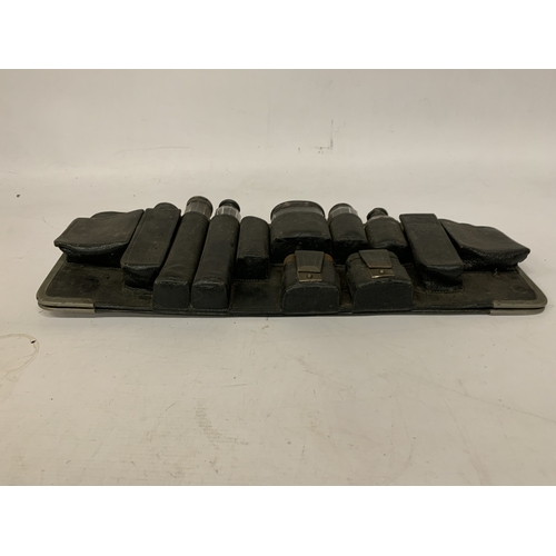 20 - A QUANTITY OF VANITY GLASS BOTTLES MOST WITH HALLMARKED SILVER LIDS, IN A HOLDER, PLUS  HALLMARKED S... 