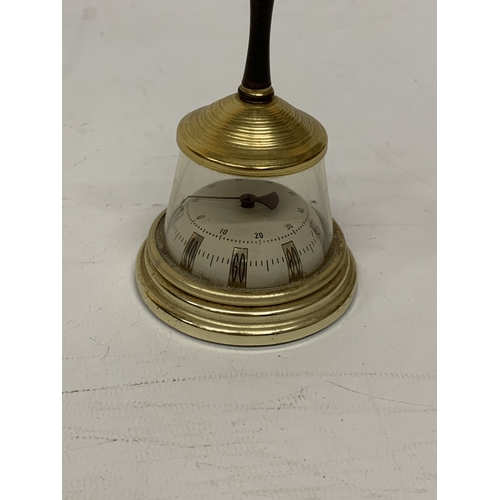 109 - A VINTAGE BRASS AND GLASS TABLE THERMOMETER