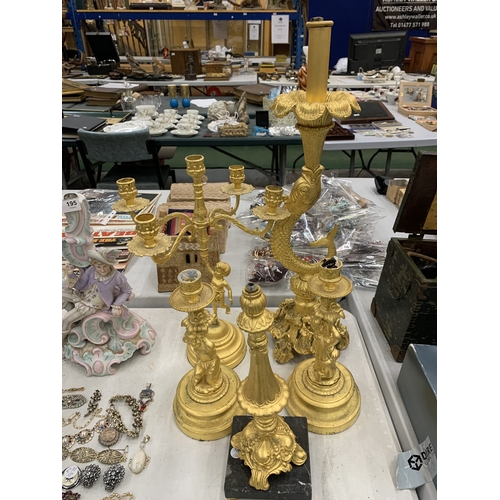 193 - A LARGE COLLECTION OF HIGHLY DECORATIVE GILT CANDLESTICKS