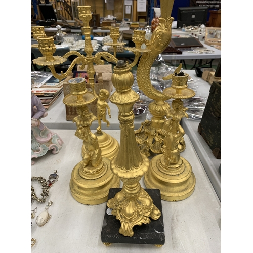 193 - A LARGE COLLECTION OF HIGHLY DECORATIVE GILT CANDLESTICKS