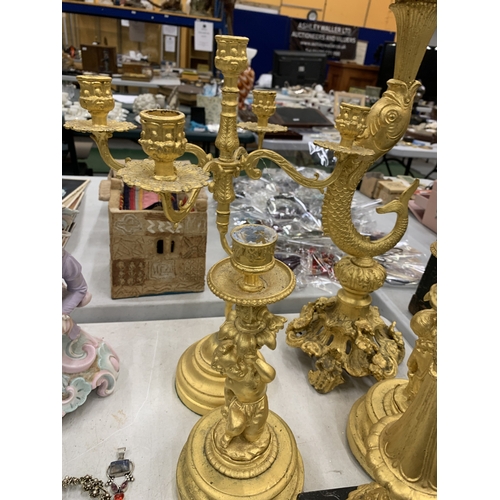 193 - A LARGE COLLECTION OF HIGHLY DECORATIVE GILT CANDLESTICKS