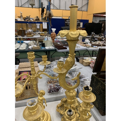 193 - A LARGE COLLECTION OF HIGHLY DECORATIVE GILT CANDLESTICKS
