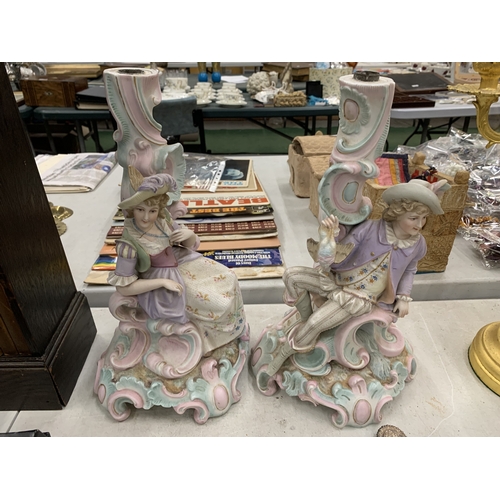 195 - A PAIR OF VINTAGE GERMAN BISQUE FIGURAL CANDLESTICKS