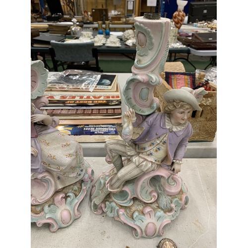 195 - A PAIR OF VINTAGE GERMAN BISQUE FIGURAL CANDLESTICKS