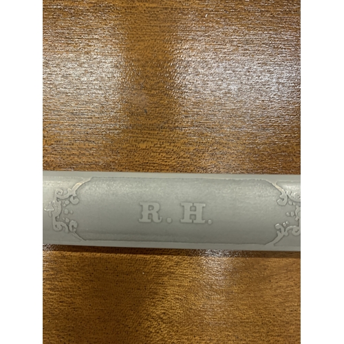 37 - AN ORNAMENTAL WILKINSON SWORD ON A WOODEN BASE, LENGTH 92CM