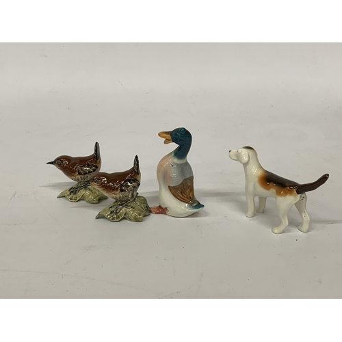 807 - FOUR BESWICK FIGURES TO INCLUDE TWO WRENS, A FOXHOUND AND A DUCK