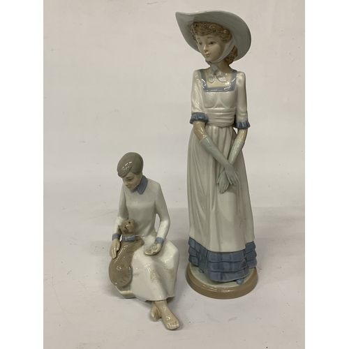 812 - TWO FIGURINES TO INCLUDE A NAO LADY AND A SPANISH LADY WITH A CAT