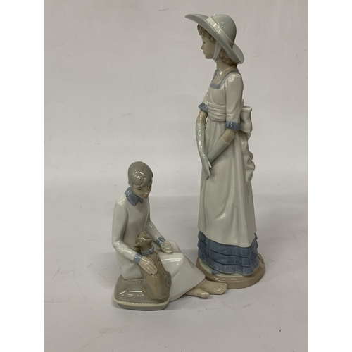 812 - TWO FIGURINES TO INCLUDE A NAO LADY AND A SPANISH LADY WITH A CAT