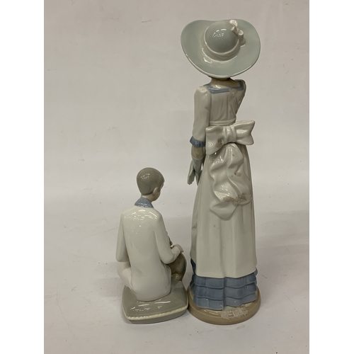 812 - TWO FIGURINES TO INCLUDE A NAO LADY AND A SPANISH LADY WITH A CAT