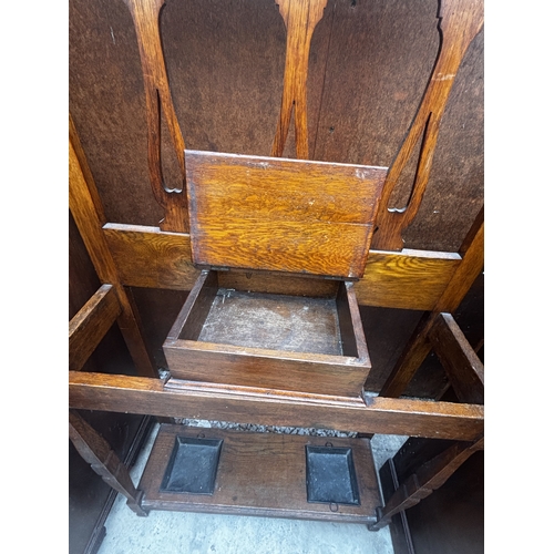 2508 - AN ART NOUVEAU OAK HALL STAND WITH MIRRORED BACK, 30