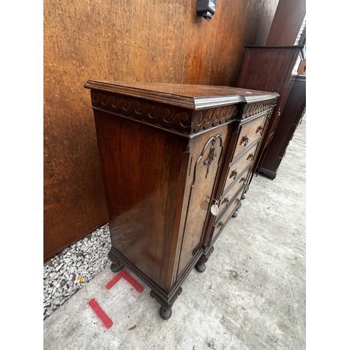2511 - A 19TH CENTURY STYLE MINIATURE WALNUT BREAKFRONT SIDEBOARD ENCLOSING DRAWERS AND TWO CUPBOARDS ON CA... 