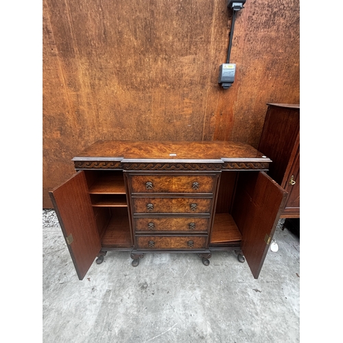 2511 - A 19TH CENTURY STYLE MINIATURE WALNUT BREAKFRONT SIDEBOARD ENCLOSING DRAWERS AND TWO CUPBOARDS ON CA... 