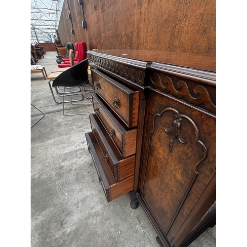 2511 - A 19TH CENTURY STYLE MINIATURE WALNUT BREAKFRONT SIDEBOARD ENCLOSING DRAWERS AND TWO CUPBOARDS ON CA... 