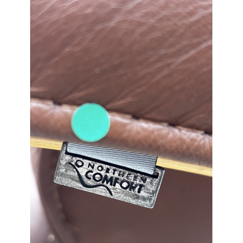 2537 - A HJELLEGJERDE NORTHERN COMFORT LEATHER SWIVEL CHAIR