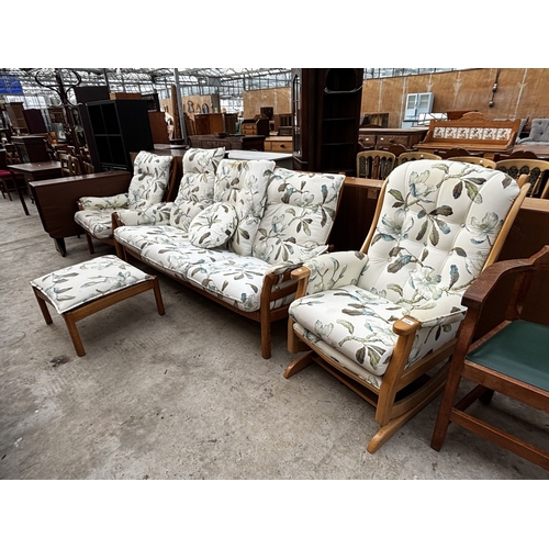 2556 - AN ERCOL THREE SEATER SETTEE, FIRESIDE CHAIR AND STOOL WITH SIMILAR UPHOLSTERED ROCKING CHAIR