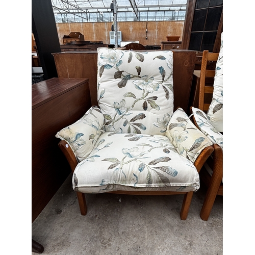 2556 - AN ERCOL THREE SEATER SETTEE, FIRESIDE CHAIR AND STOOL WITH SIMILAR UPHOLSTERED ROCKING CHAIR
