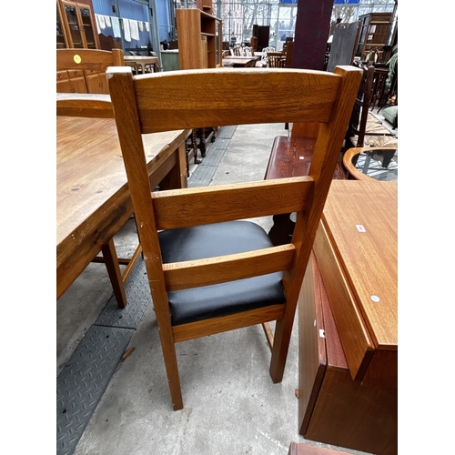 2593 - A HEAVY SOLID OAK DINING TABLE, 55