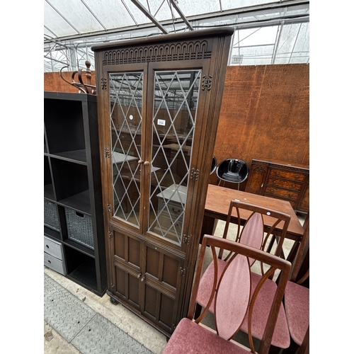 2596 - A PRIORY OAK CORNER CUPBOARD WITH GLAZED AND LEADED UPPER PORTION, 27