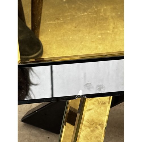2612 - A PAIR OF BLACK GLASS BEDSIDE CHESTS EACH WITH TWO GOLD COLOURED DRAWERS AND MIRRORED LEGS