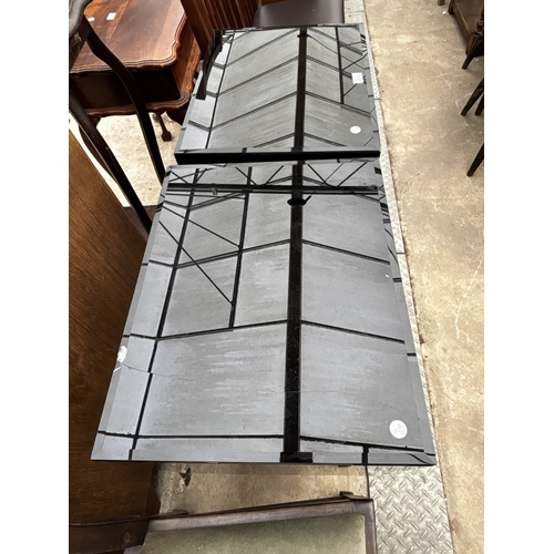 2612 - A PAIR OF BLACK GLASS BEDSIDE CHESTS EACH WITH TWO GOLD COLOURED DRAWERS AND MIRRORED LEGS