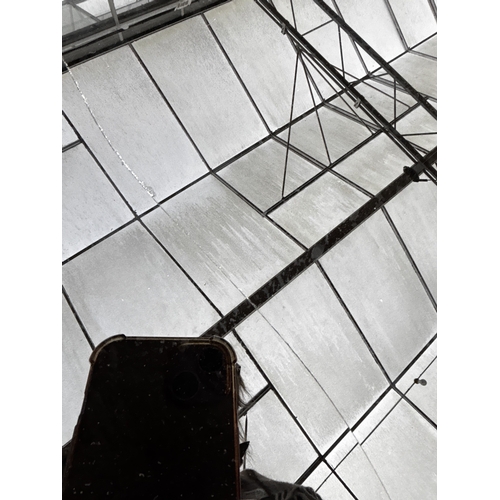 2612 - A PAIR OF BLACK GLASS BEDSIDE CHESTS EACH WITH TWO GOLD COLOURED DRAWERS AND MIRRORED LEGS