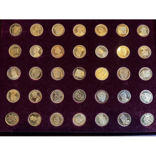 321 - A BOXED SET OF SEVENTY SILVER GILT SOVEREIGNS