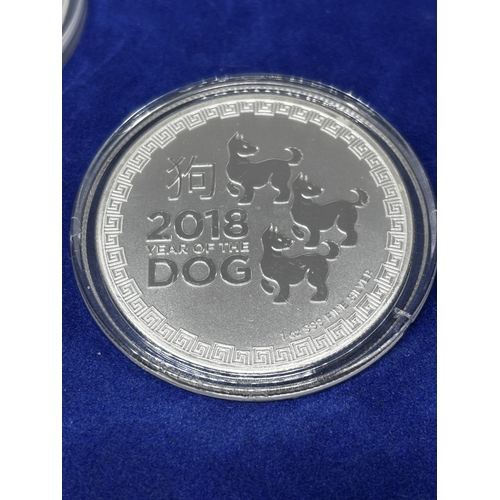 323 - A BOXED SET OF FOUR SILVER PROOF COINS 2018 YEAR OF THE DOG