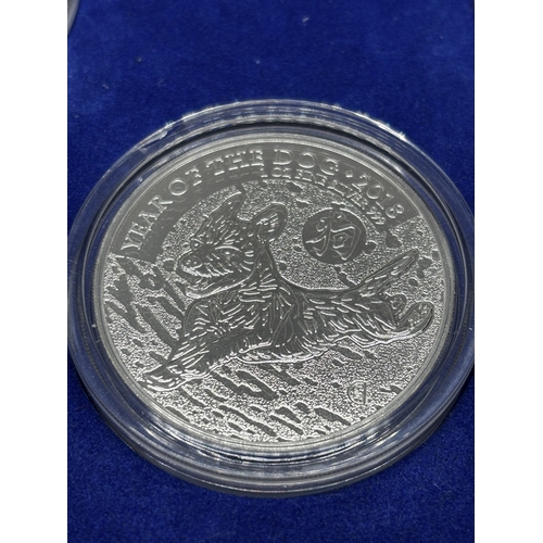 323 - A BOXED SET OF FOUR SILVER PROOF COINS 2018 YEAR OF THE DOG