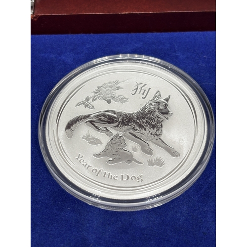 323 - A BOXED SET OF FOUR SILVER PROOF COINS 2018 YEAR OF THE DOG