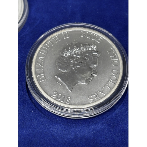 323 - A BOXED SET OF FOUR SILVER PROOF COINS 2018 YEAR OF THE DOG