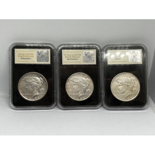 329 - A BOXED PROOF SET OF THREE U.S.A PEACE DOLLAR COINS