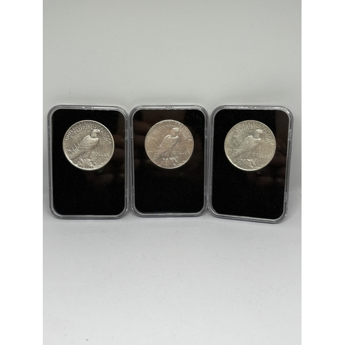329 - A BOXED PROOF SET OF THREE U.S.A PEACE DOLLAR COINS