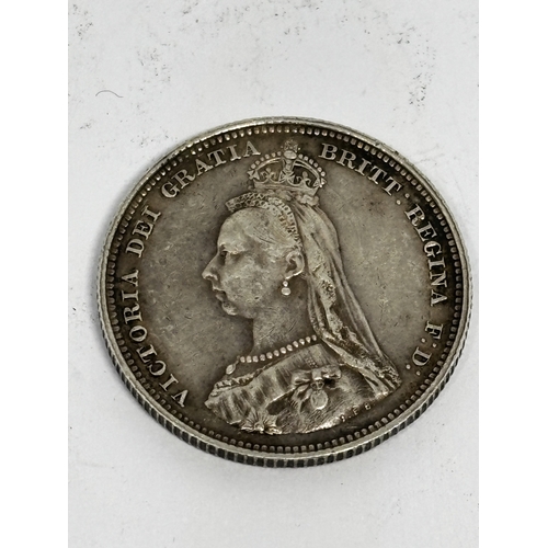 335 - AN 1887 VICTORIAN SHILLING