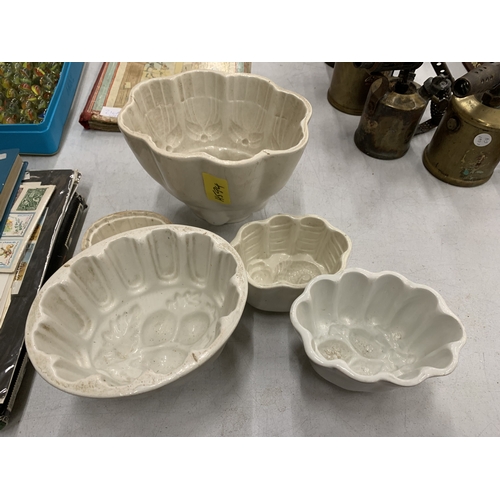 210 - A COLLECTION OF VINTAGE CERAMIC JELLY MOULDS