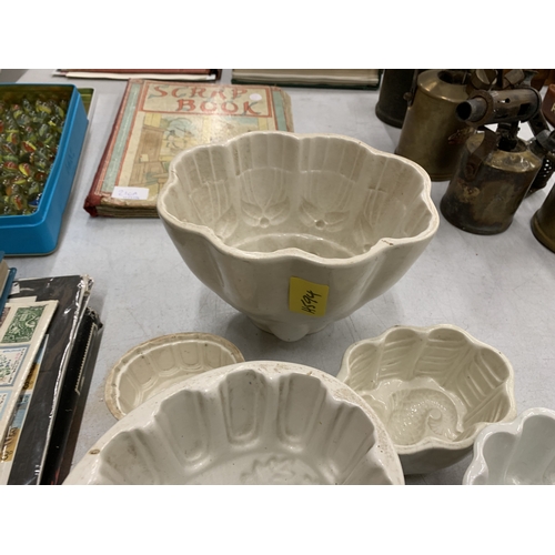 210 - A COLLECTION OF VINTAGE CERAMIC JELLY MOULDS