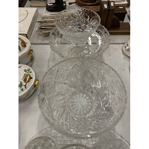 218 - A LARGE ASSORTMENT OF CUT GLASSWARE TO INCLUDE LARGE PLATES AND BOWLS, CAKE STANDS, JUGS ETC