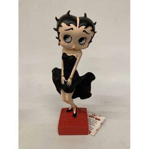 233 - A BETTY BOOP FIGURINE IN A GLITTER DRESS