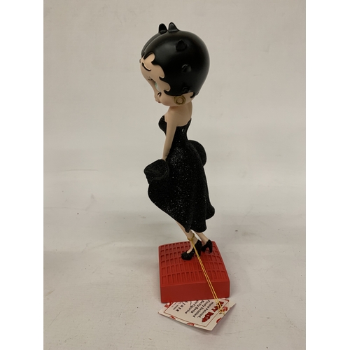 233 - A BETTY BOOP FIGURINE IN A GLITTER DRESS