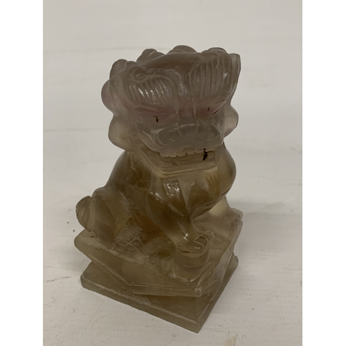 371 - A CHINESE ROCK CRYSTAL POSSIBLY SMOKY QUARTZ CARVED INTO A  PAIR OF FOO DOGS/GUARDIAN LIONS - 12 CM