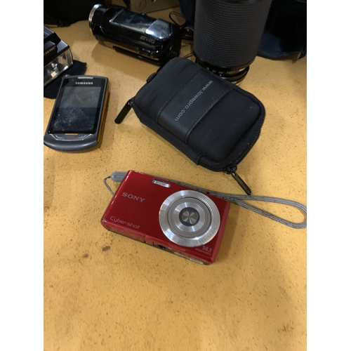 456 - A COLLECTION OF CAMERAS TO INCLUDE OLYMPUS, SONY CYBERSHOT, ETC PLUS ASAMSUNG PHONE, BAGS, ETC