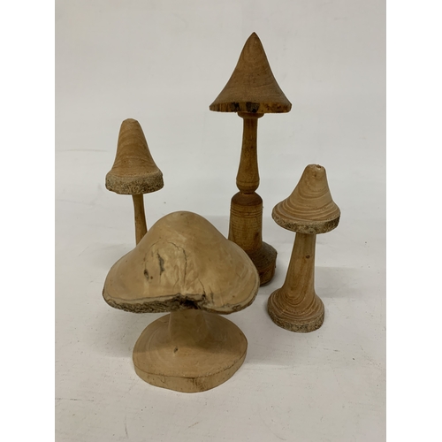 463 - A COLLECTION OF HAND TURNED AND CARVED WOODEN MUSHROOMS