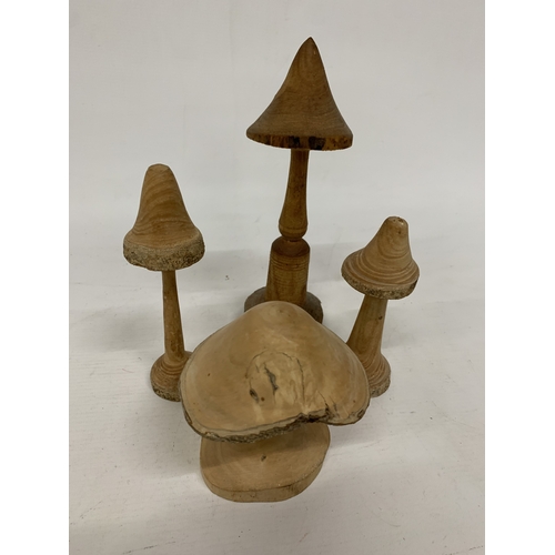 463 - A COLLECTION OF HAND TURNED AND CARVED WOODEN MUSHROOMS