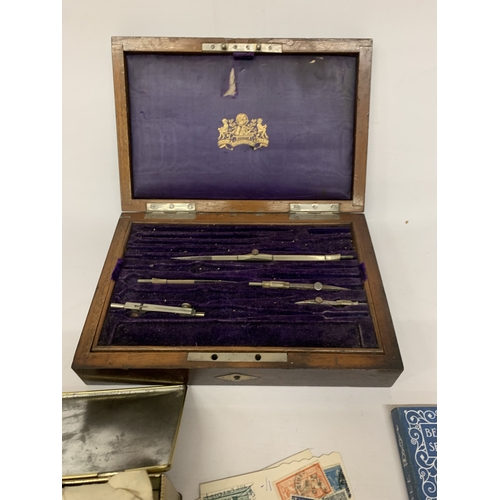 270 - A WOODEN CASED PART DRAUGHTSMAN SET, DECORATIVE TIN CONTAINING LOOSE STAMPS AND A CONSTABLE BELL'S M... 