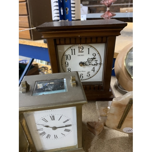 903 - SIX CLOCKS TO INCLUDE A WALL CLOCK, TWO CARRIAGE CLOCKS AN ANNIVERSARY CLOCK, ETC