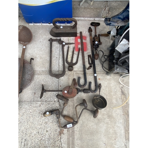 1544 - AN ASSORTMENT OF VINTAGE TOOLS TO INCLUDE BRACE DRILLS, A FLAT IRON AND A FORK HEAD ETC