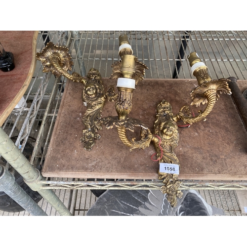 1558 - A PAIR OF DECORATIVE BRASS WALL LIGHTS